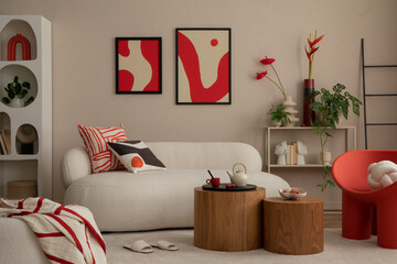 Interior design of modern and cozy living room interior with mock up poster frame, red armchair, wooden coffee table, pillows, vase with flowers and personal accessories. Home decor. Template.
