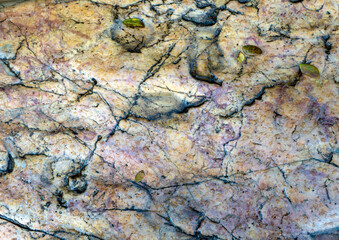 Volcanic stone background, rock surface wallpaper backdrop with rough texture