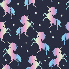 Seamless pattern of rainbow unicorns on a blue background. For boys and girls. for textiles.