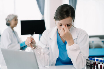 Female scientist are under stress from working in research lab.