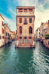 Fototapeta na wymiar Floating house on canal in Venice, Italy
