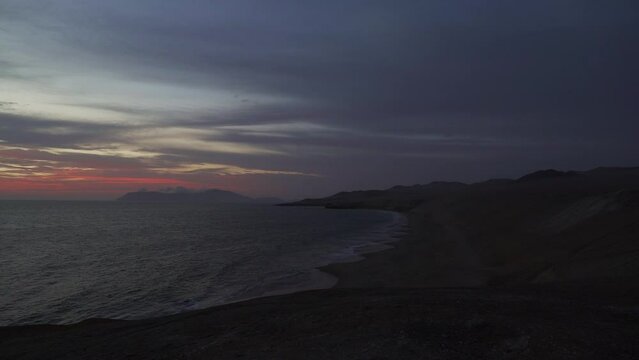 sunset with golden light over the paracas, Peru.