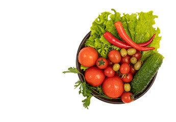 Fresh vegetables in a plate isolated on white