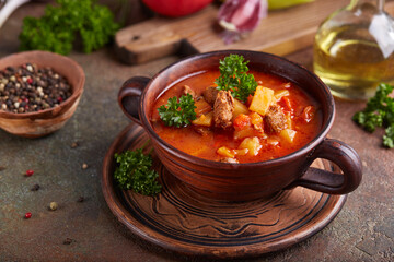 Goulash soup with beef, sweet pepper and potatoes. Stew of meat and vegetables, flavored with paprika. Hungarian cuisine. 