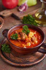 Goulash soup with beef, sweet pepper and potatoes. Stew of meat and vegetables, flavored with paprika. Hungarian cuisine. 