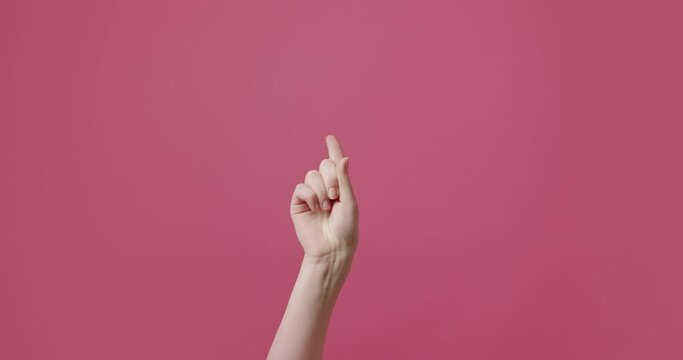 Access forbidden. Shaking finger saying no. Finger signal.A woman's hand gesticulates, shows a sign that it is not possible, wags its finger in different parts. Disapproving gesture. Negation gesture