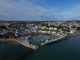Paignton, Torbay, South Devon, England: DRONE VIEW: The drone photo shows Paignton Harbour and its entrance, the sea and the town of Paignton in the background.