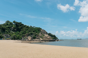 Fototapeta na wymiar Beach, Ocean, and Mountains on Gulangyu Island, Xiamen, Fujian Province, China