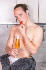Young sexy guy in the kitchen.