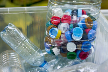 A container made of plastic bottles and plastic lids. Garbage collection around the world. Clean the planet of plastic garbage. Ecology. Sorting garbage.