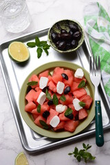 Summer salad with watermelon and cheese , lime and mint.