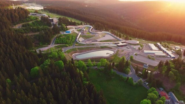 The Toboggan run in Oberhof in warm light in the evening. Drone move to the left