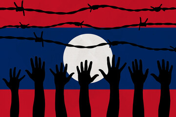 Laos flag behind barbed wire fence. Group of people hands. Freedom and propaganda concept