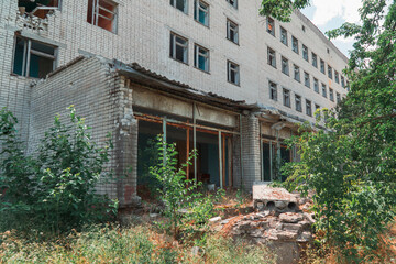 Fototapeta na wymiar Administrative building damaged by shelling. War in Ukraine