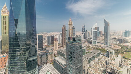 Fototapeta na wymiar Panorama showing futuristic skyscrapers in financial district business center in Dubai on Sheikh Zayed road timelapse