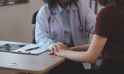 Cropped shot of a female nurse hold her senior patient's hand. Giving Support. Doctor helping old patient with Alzheimer's disease. Female carer holding hands of senior man