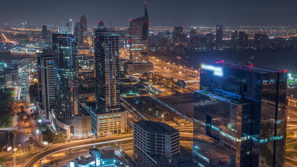 Obraz premium Aerial view of media city and al barsha heights district area all night timelapse from Dubai marina.