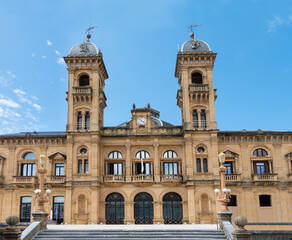 Fototapeta na wymiar Old City hall of San Sebastian, Spain. Also called Donostia in Basque. Blue sky background.