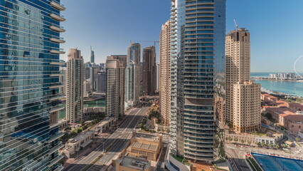 Panoramic view of the Dubai Marina and JBR area and the famous Ferris Wheel aerial timelapse