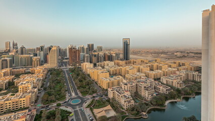 Fototapeta premium Panorama showing skyscrapers in Barsha Heights district and low rise buildings in Greens district aerial timelapse. Dubai skyline