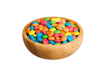 Multicolored candies in a bowl on a colored background. birthday and holiday concept. Top view with...