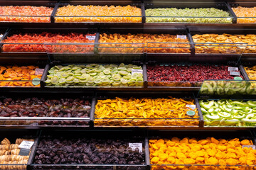 Image of many dryed fruits on store in market.