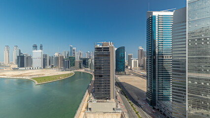 Naklejka premium Cityscape skyscrapers of Dubai Business Bay with water canal aerial timelapse.