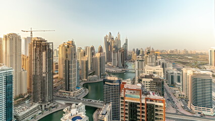 Panorama showing various skyscrapers in tallest recidential block in Dubai Marina aerial timelapse