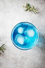 A glass of cocktail, Blue Lagoon. cool. on a gray background