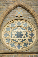 The rose window with David Star on the Gothic Revival style Roman Catholic Cathedral of Saint Andrew in Little Rock, Arkansas, United States