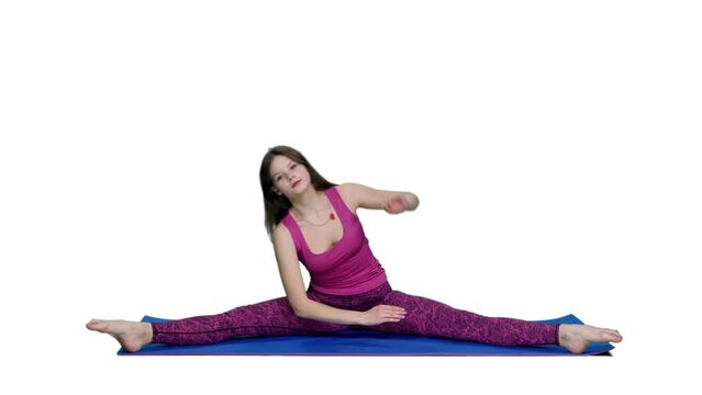 Young flexible woman doing side bends sitting in splits on fitness mat, Full HD footage with alpha transparency channel isolated on white background