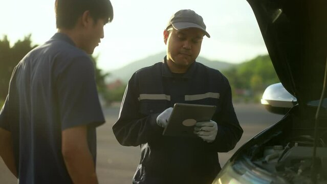 Car owner handshake to thank the skilled mechanic who repaired and take excellent care of their vehicle. Repair car outside service.