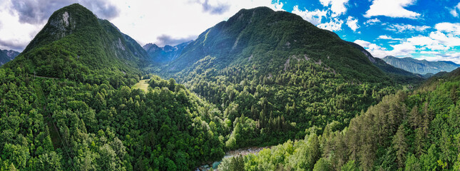 Alpine landscape with green forest in Soca valley, Slovenia. Aerial drone view