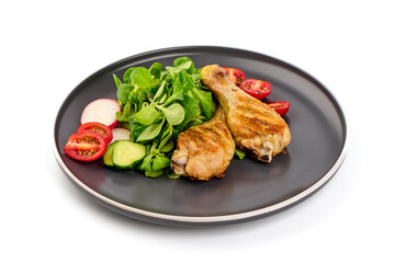 Grilled chicken with vegetables, isolated on white background.