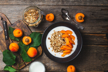 Granola with yogurt and apricots in a bowl