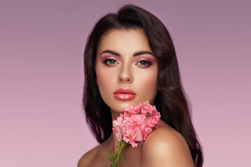 Portrait beautiful young woman with clean fresh skin. Model with healthy skin, close up portrait. Cosmetology, beauty and spa. Girl with a rose flower - obrazy, fototapety, plakaty