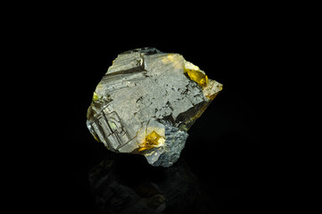 Fototapeta premium Sphalerite yellow crystal (cleiophane) isolated on black background. macro detail close-up rough raw unpolished semi-precious gemstone.