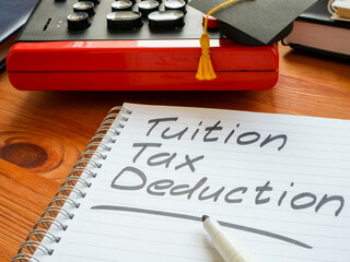 Tuition tax deduction mark in the notebook.