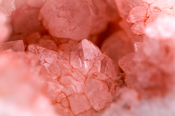 artificially pink dyed quartz geode detail.  macro detail texture background. close-up raw rough...