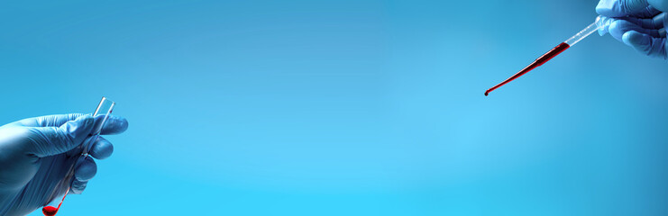 Pipette drip red liquid drops into laboratory test glass tubes, nobody. Long banner.