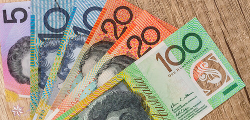 Australian dollar on wooden table close up