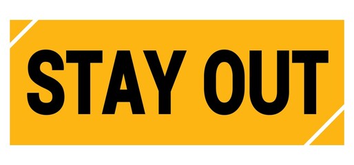 STAY OUT text on yellow-black grungy stamp sign.
