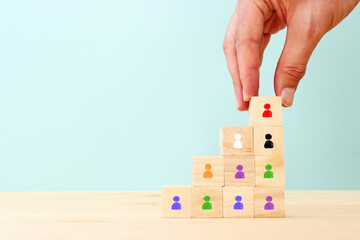 image of wooden cubes with people figures, human resources, leadership and management concept