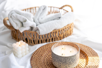 Spa composition with candles on a blurred background.
