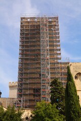 Monument restoration. Renovation works with scaffolding. Palais des Papes (Palace of the Popes) -...