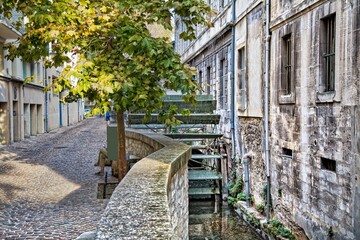 Rue des Teinturiers historic street in Avignon, France.