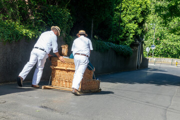 Toboggan Ride on Traditional Wicker Basket Sledges in Monte Funchal, Madeira island, Portugal