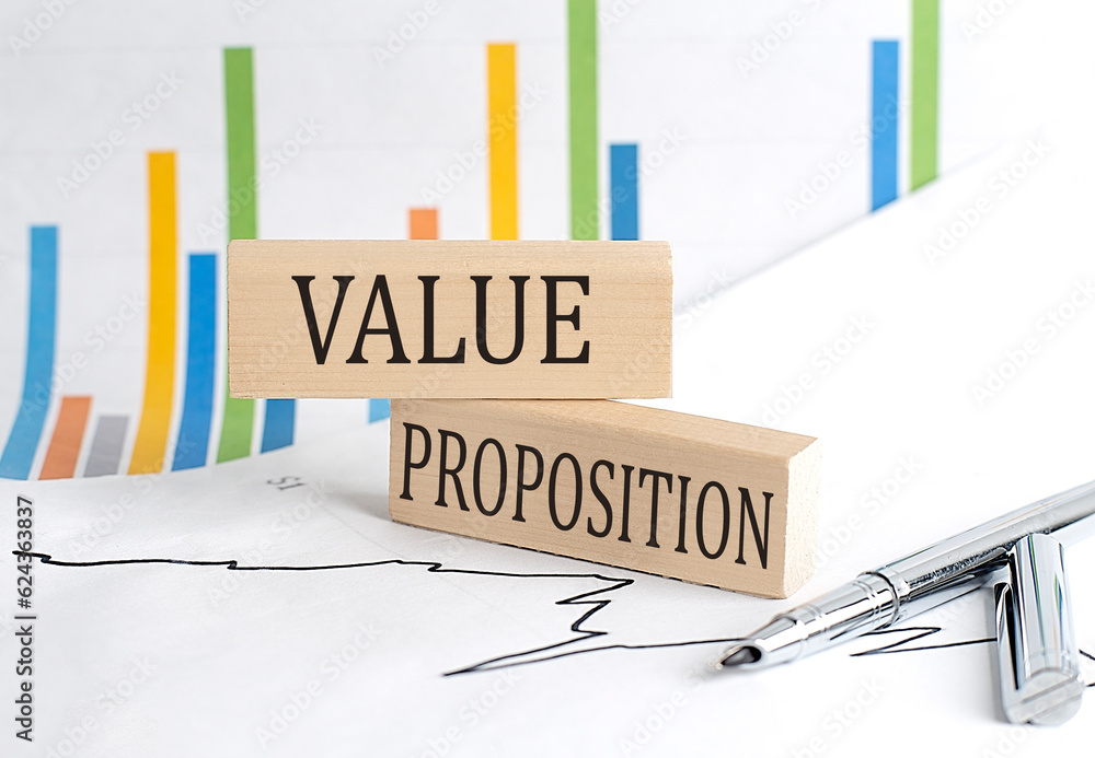 Poster value proposition text on a wooden block on chart background , business concept