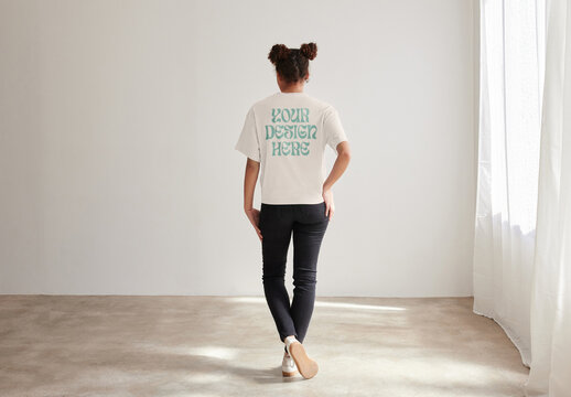 Mockup of woman wearing customizable t shirt, rear view