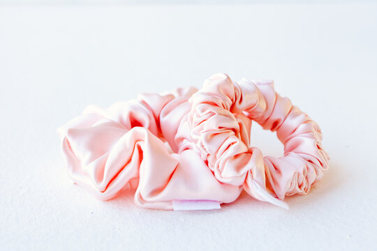 pink silk Scrunchy isolated on white background. Hairdressing tool of Colorful Elastic Hair Band, Bobble Scrunchie Hairband. square image